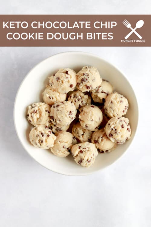 A white bowl full of chocolate chip cookie dough bites.