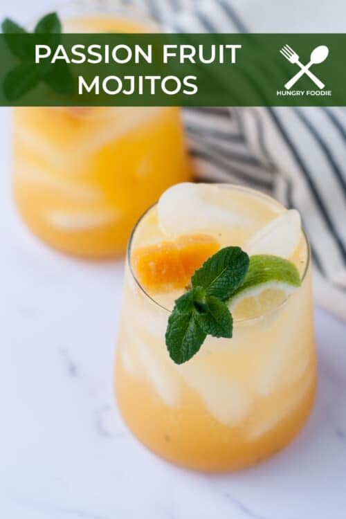passion fruit mojito over ice, garnishes with lime mint and passion fruit, served with a stainless steel straw