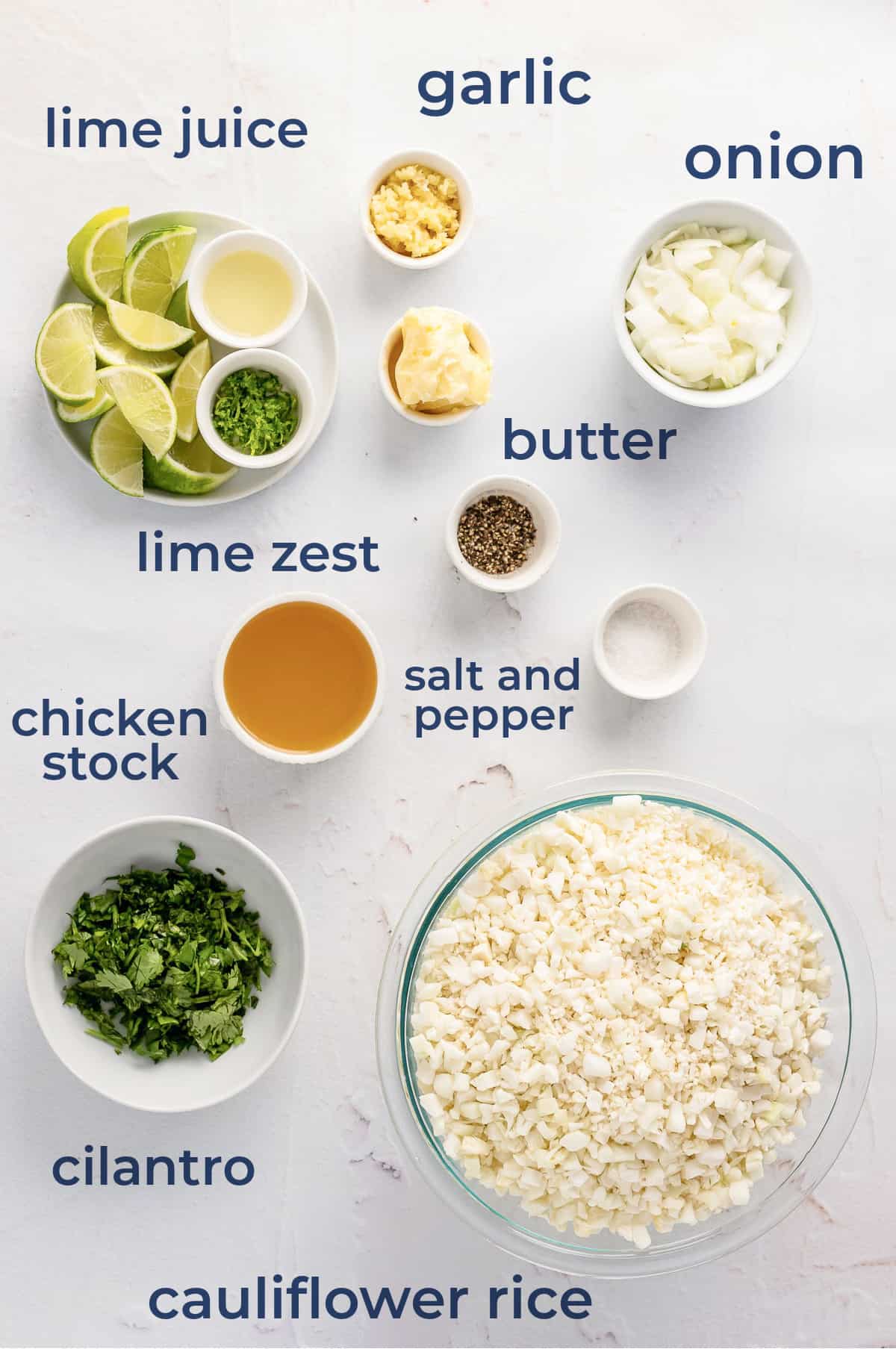 ingredients for cilantro lime cauliflower rice - lime, cauliflower, onion, garlic, chicken stock, salt and pepper