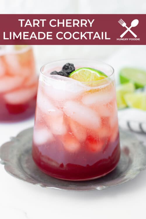 refreshing summer cocktail with tart cherry juice, lime juice, soda water and vodka, served with fresh lime wedges
