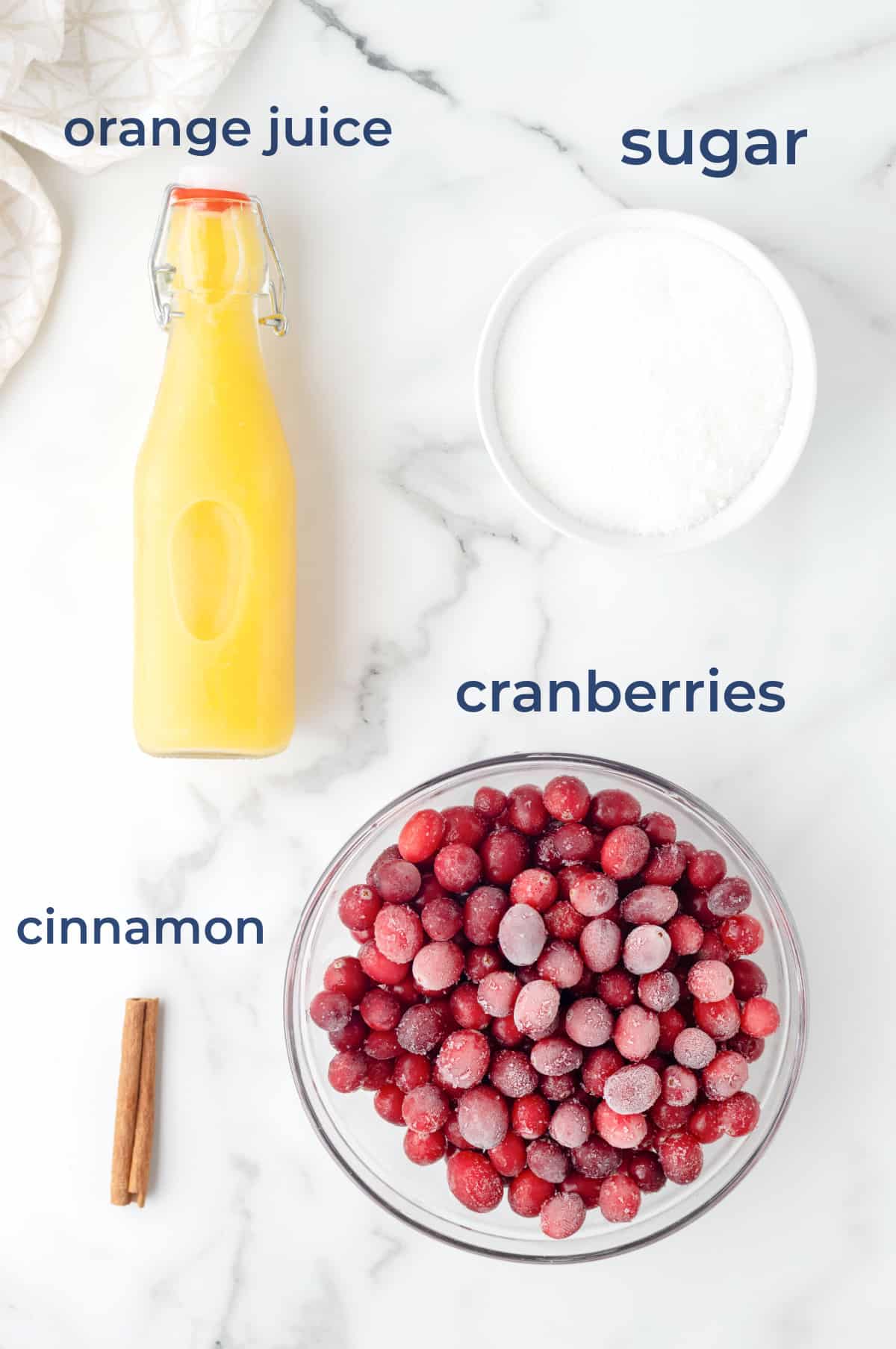 ingredients for homemade cranberry sauce - cranberries, sugar, cinnamon and orange juice