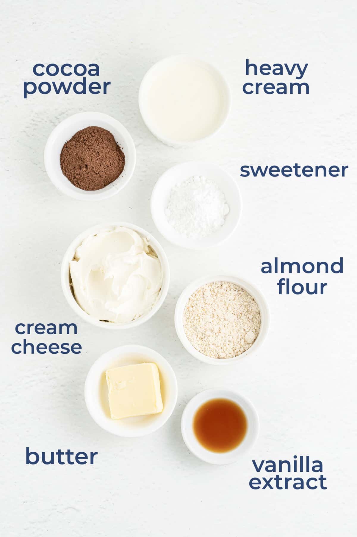 Ingredients all laid out in individual cups to make chocolate cheesecake mousse