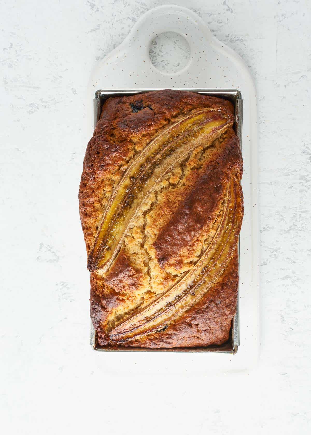 a freshly baked loaf of banana bread, fresh out of the oven.